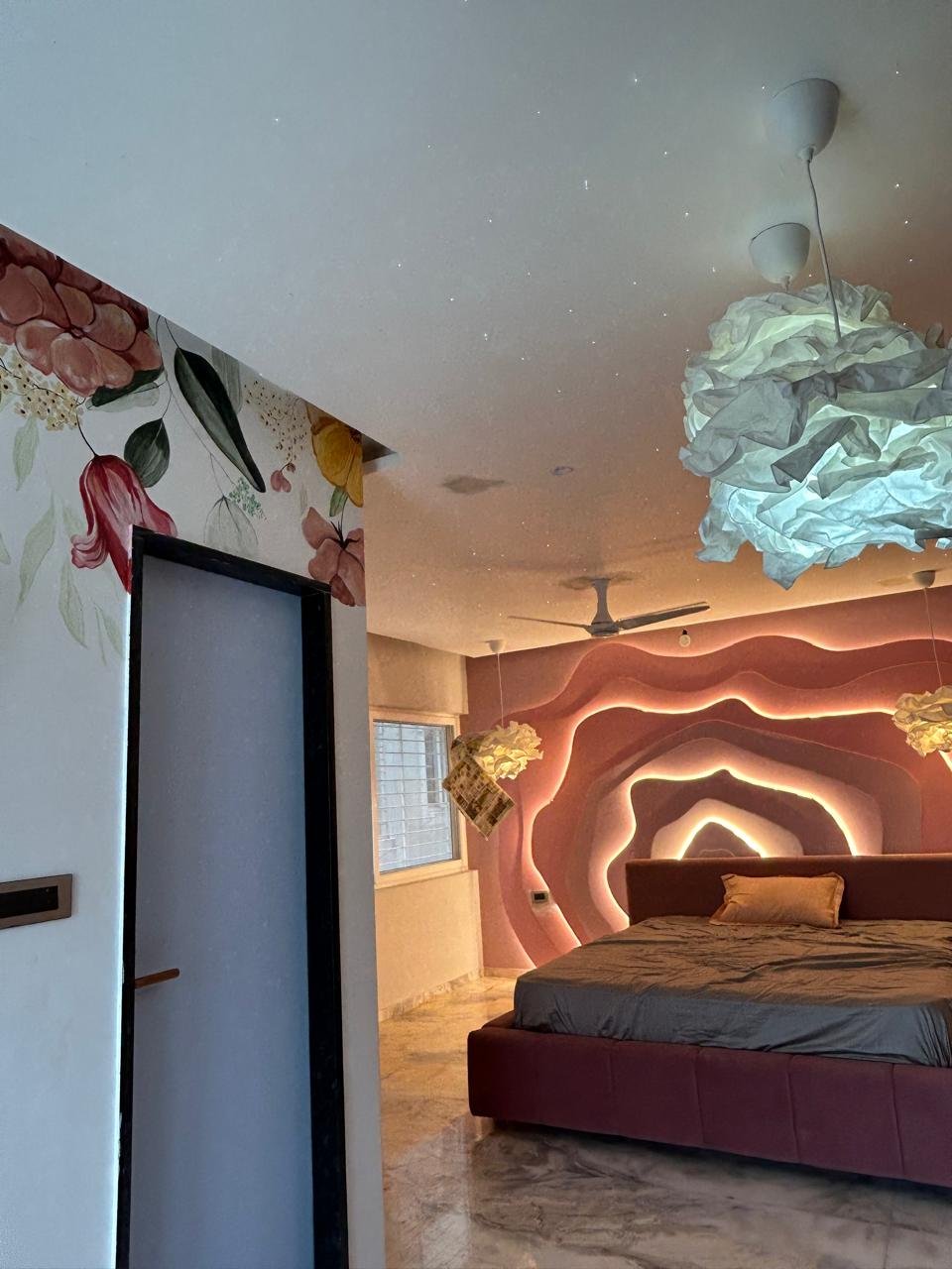 Executed floral mural bedroom with LED wave wall by Humming House