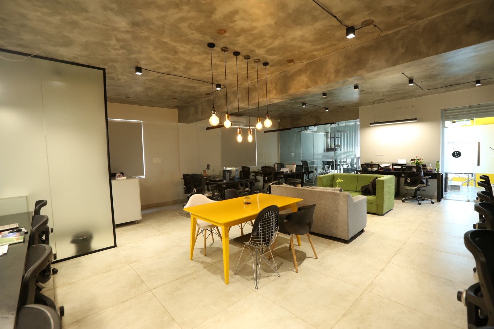 Co-working lounge with Edison pendants by Humming House